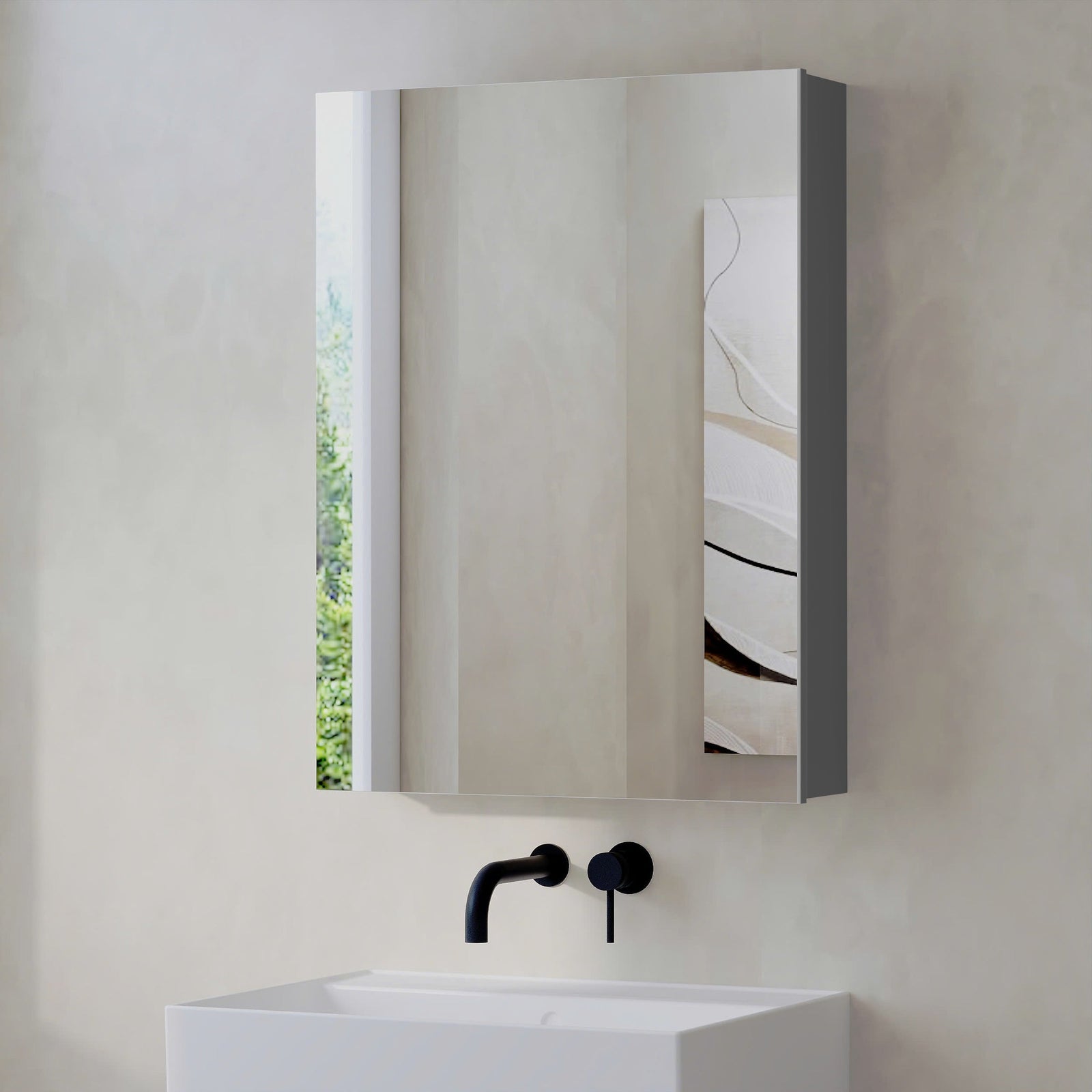 Grey Lavio mirror cabinet mounted above bathroom sink, closed mirrored door
