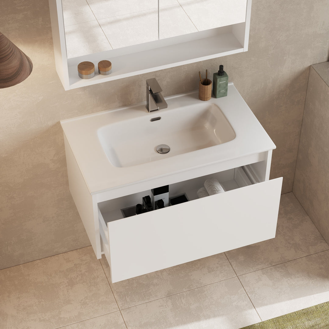 Interior view of vanity drawer open, showing storage space with metal supports and smooth glides.