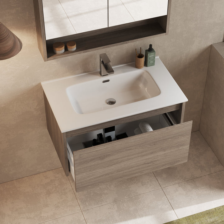 Mino vanity unit mounted beneath mirror, with accessories on surface