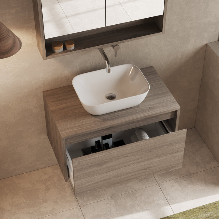 Mino 800 mm wall hung unit with basin above, showing sleek silhouette against tiled wall