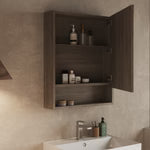 Close-up corner view of the mirror door and frame in Nebraska Oak finish