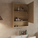 Angled view showing the cabinet’s mirror door, wood grain frame, and open shelf beneath