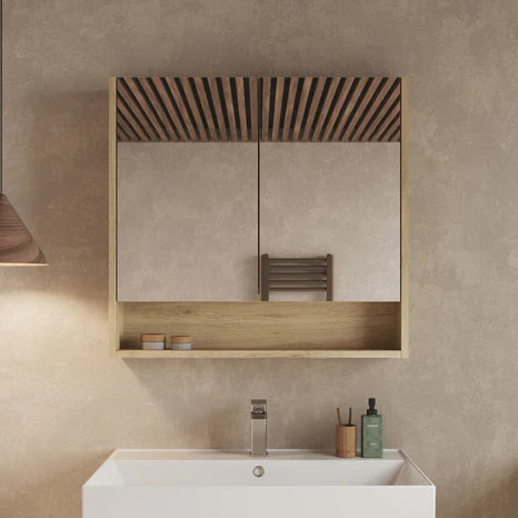 Banyetti Mino double-door mirror cabinet in natural oak mounted above a bathroom sink, two mirrored doors closed